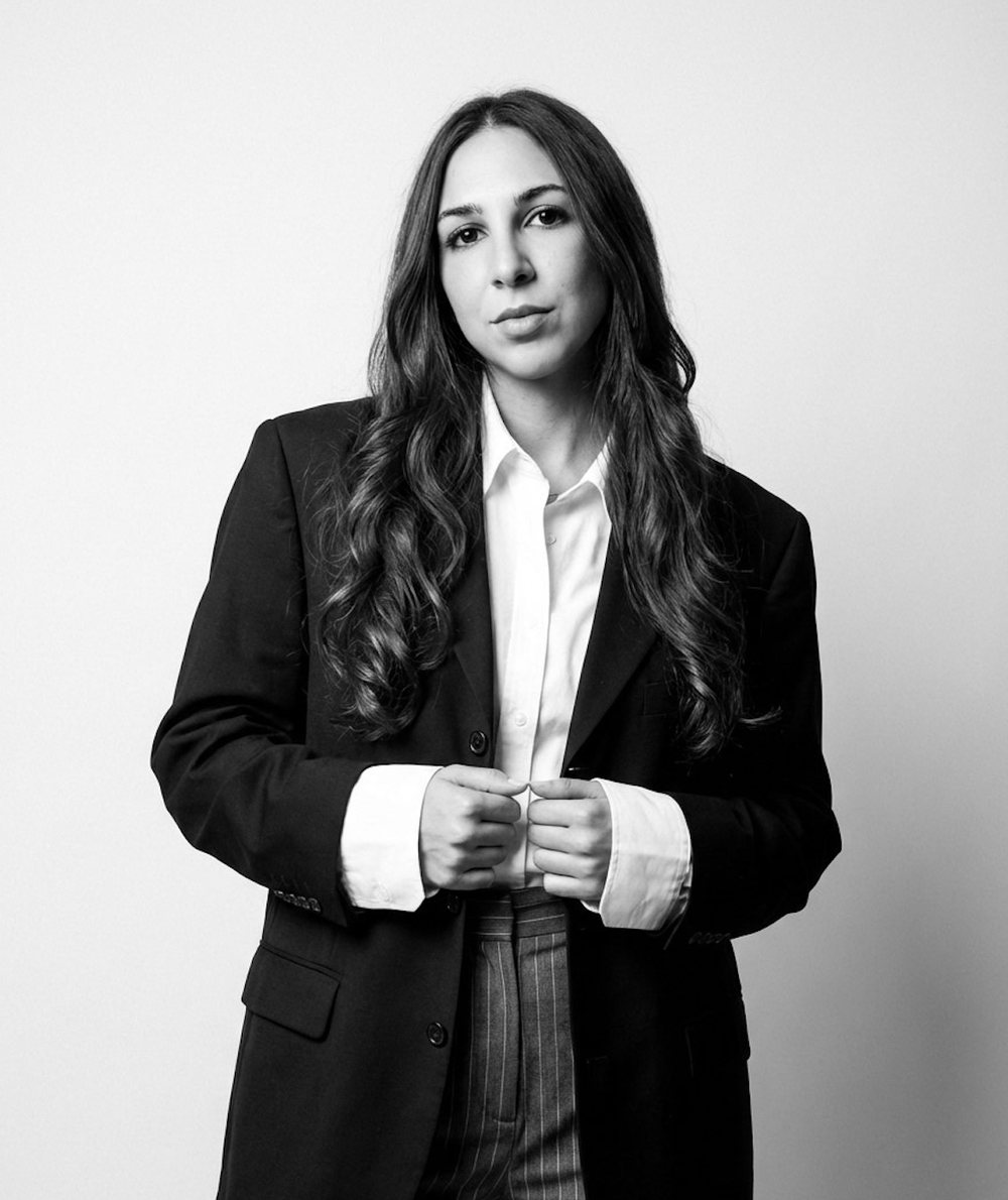 Chiara, founder of Filo Partners, in a black blazer and white shirt